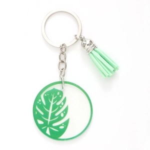 Green acrylic monstera leaf keychain with stylish matching tassel and metal ring