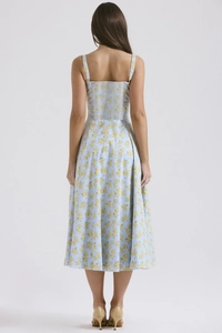 Back view of a light blue floral midi dress with delicate spaghetti straps for summer