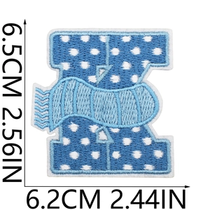 Close-up of blue embroidered patch showing precise dimensions 6.5cm height and 6.2cm width
