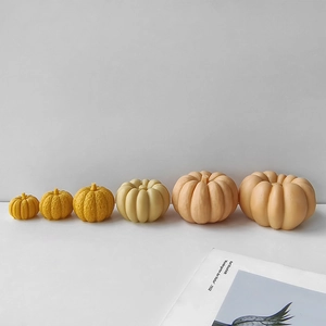 Set of six realistic 3D pumpkin models in various sizes and warm yellow tones