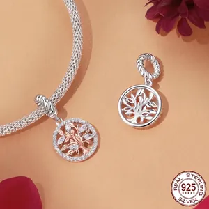 Sterling silver Tree of Life charm with rose gold accents and zircons on snake chain