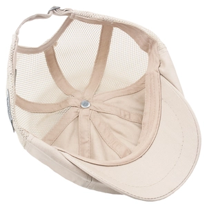 Close-up of beige mesh newsboy cap interior showing breathable structure and sweatband