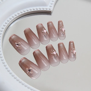 Long coffin cat-eye press-on nails with grey-purple ombre and pink crystal floral accents