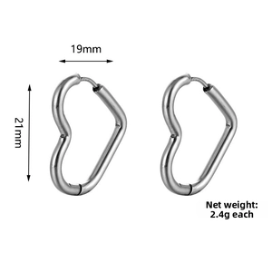 Macro view of heart-shaped stainless steel earrings with dimension markings in mm