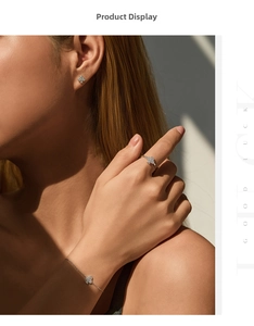 Silver four-leaf clover jewelry set with sparkling pavé diamonds on a model