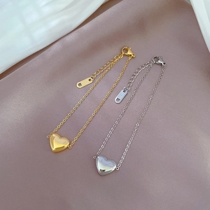 Minimalist heart chain bracelets in gold and silver finish stainless steel on satin