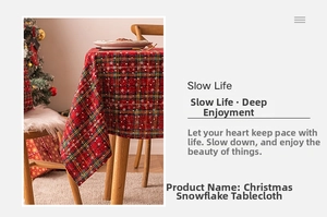 Detail of Christmas plaid tablecloth with white snowflake patterns and festive decor