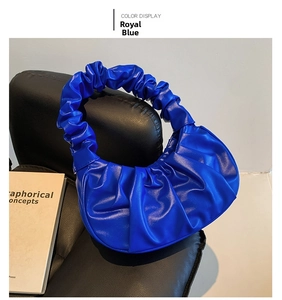 Detailed view of the royal blue ruched handbag with high-quality PU leather texture