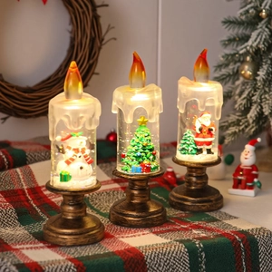 Trois bougies LED de Noël avec bonhomme de neige et Père Noël effet boule à neige