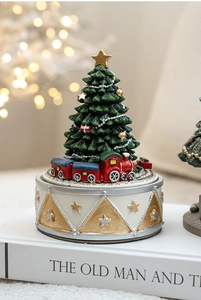 Detailed Christmas tree music box with festive ornaments and mini train on rotating base