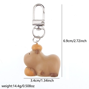 Detailed view of Capybara keychain size 6.9cm by 3.4cm with silver metal D-ring clip
