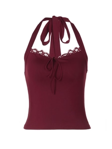 Detail of burgundy lace halter top with front tie and intricate floral edging