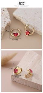 Detailed size view of gold stainless steel heart earrings with red crystal stones