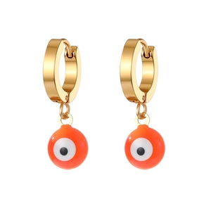 Detail of gold evil eye hoop earrings featuring orange enamel drip oil charms