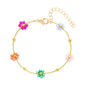 Gold chain bracelet featuring colorful woven bead flowers with lobster clasp closure