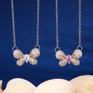 Elegant butterfly pendant necklace with pink and clear zircons on a silver chain
