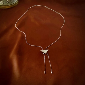 Elegant silver Y-shaped tassel necklace with sparkling rhinestone triangle pendant