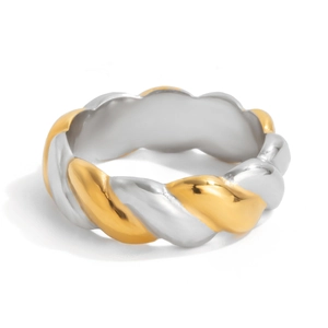 Macro detail of 18K gold and silver two-tone stainless steel twisted rope open ring