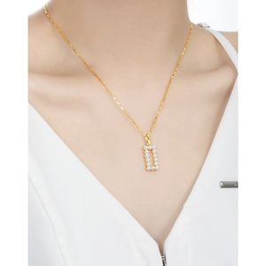 French style S925 silver necklace with geometric pearl pendant worn by a model