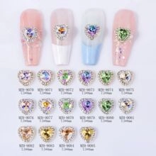 Macro detail of heart-shaped nail art rhinestones with crystal border in multiple colors