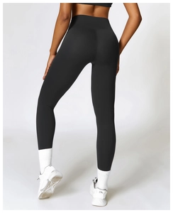 Rear view of black high waisted yoga pants showing butt lifting and tummy control fit