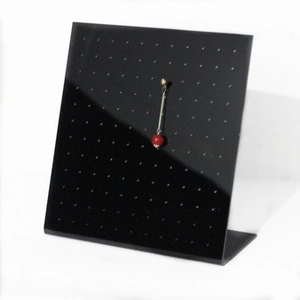 L-shaped black acrylic jewelry stand with multi-hole design for earring storage