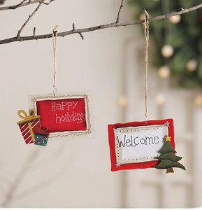 Detail of red and white wooden Christmas ornaments with tree patterns on branches