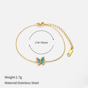 Detail of gold butterfly bracelet with blue zircon showing dimensions and material labels