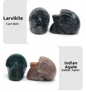 Detail view of Larvikite and Indian Agate crystal skulls for Halloween decoration