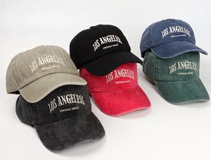 Detailed close-up of vintage washed cotton baseball caps with embroidered Los Angeles logo