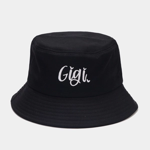 Close-up of Gigi letter embroidery on black cotton twill bucket hat with reinforced brim