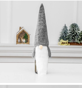 Detail of Christmas gnome wine bottle cover with grey felt hat and long faux fur beard