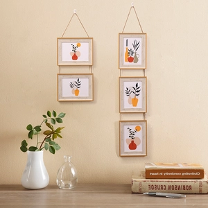 Minimalist wall hanging photo frames with hemp rope and botanical art prints for home decor