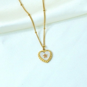 Detail of 14K gold plated heart shell necklace with pink star crystal and bead chain