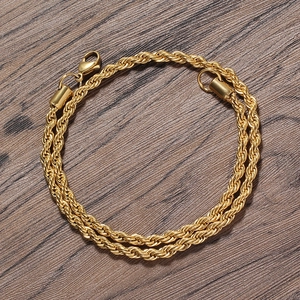 Macro detail of 5mm gold-plated stainless steel rope chain with a lobster clasp closure