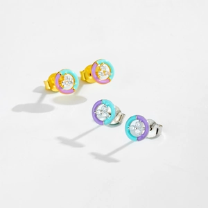 Macro detail of 925 sterling silver stud earrings with colorful enamel and inlaid zircon stones