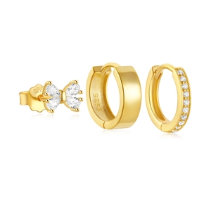 Macro detail of three-piece gold-plated S925 silver earring set with clear gemstones