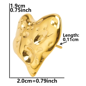 Detail view of heart-shaped gold earring with hammered texture and dimension labels