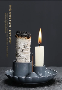 Macro view of grey ceramic Palo Santo burner with fireproof base and candle holder