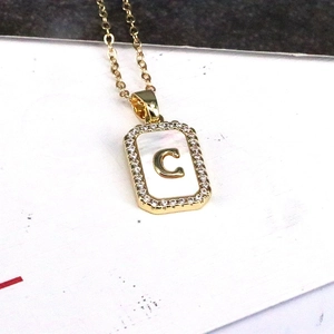 18K gold plated shell necklace with zircon crystals and a bold rectangular letter C pendant