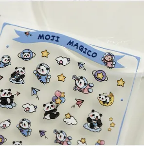 Macro shot of 3D panda astronaut nail stickers with cute stars and planet designs