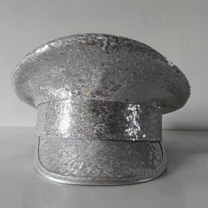 Detailed view of shimmering silver sequins on a captain hat with reflective texture
