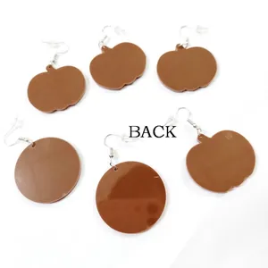 Back view of leopard print pumpkin and sunflower earrings with silver hooks