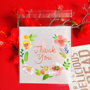 Detail of pink floral wreath Thank You card inside a transparent self-adhesive plastic bag