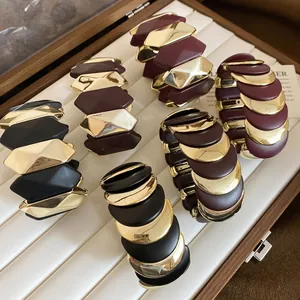Elastic wide moon moon bracelets in black, burgundy and gold matte resin with gold metal