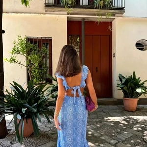 Blue hollow-out embroidery two-piece set with tie-back top and midi skirt outdoor view