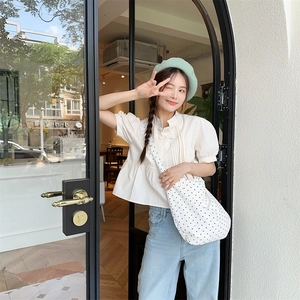 Chic summer street style outfit featuring a black and white polka dot canvas tote bag