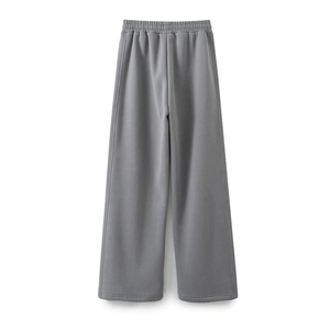 Close-up of dark grey wide-leg lounge pants with elastic waist and soft knit texture