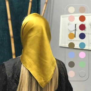 Detail of a crinkle cotton scarf in yellow with a multi-color selection swatch display