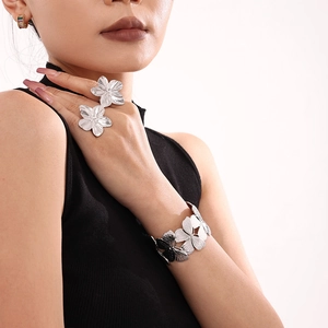 Elegant hollowed flower cuff bracelet and ring set in silver stainless steel for women